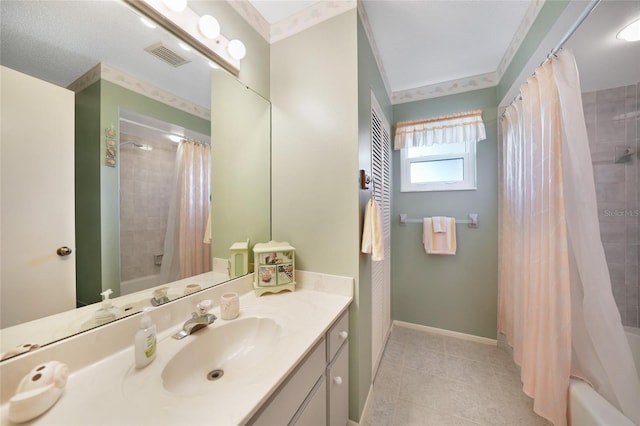 bathroom with visible vents, baseboards, vanity, and shower / tub combo with curtain