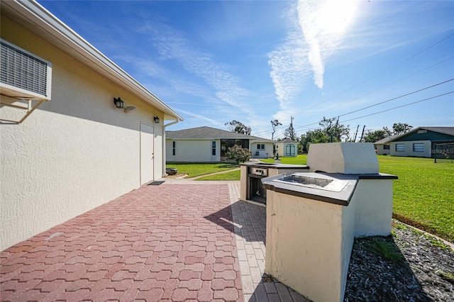 view of patio / terrace featuring an outdoor fire pit and a residential view