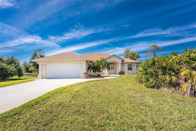 view of front of property with a garage, concrete driveway, a front lawn, and stucco siding