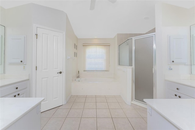 bathroom with a stall shower, ceiling fan, tile patterned floors, vaulted ceiling, and a bath