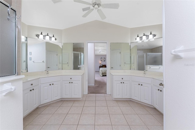 ensuite bathroom with ensuite bathroom, ceiling fan, a stall shower, and a sink