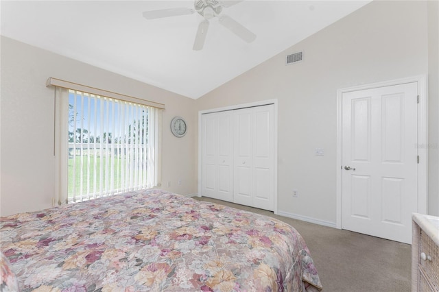 bedroom featuring lofted ceiling, light colored carpet, a ceiling fan, visible vents, and a closet