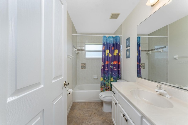 bathroom featuring toilet, shower / tub combo, vanity, visible vents, and tile patterned floors