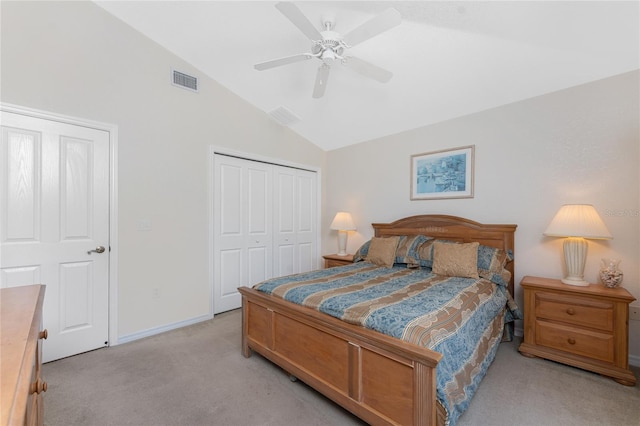 bedroom with light carpet, baseboards, ceiling fan, vaulted ceiling, and a closet