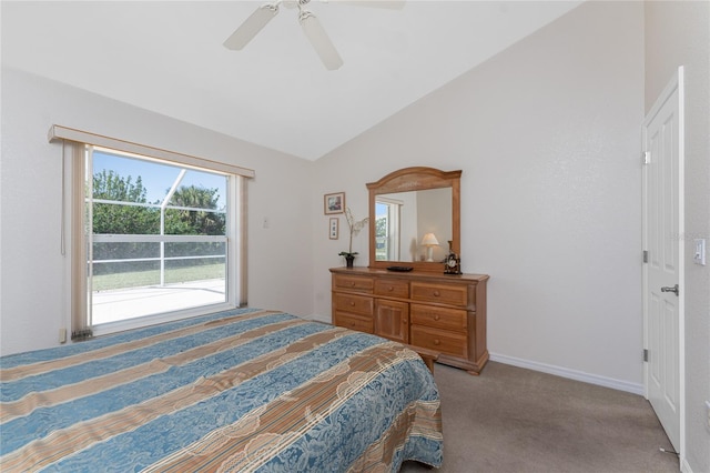 bedroom featuring a ceiling fan, light colored carpet, vaulted ceiling, and baseboards