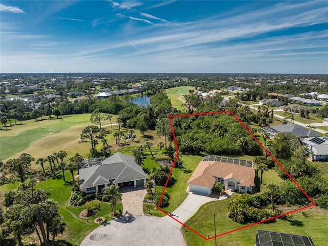 birds eye view of property with a water view and view of golf course