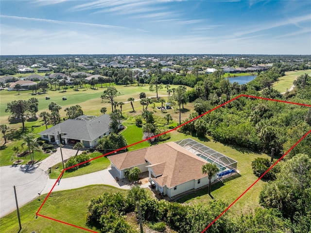 birds eye view of property with a water view