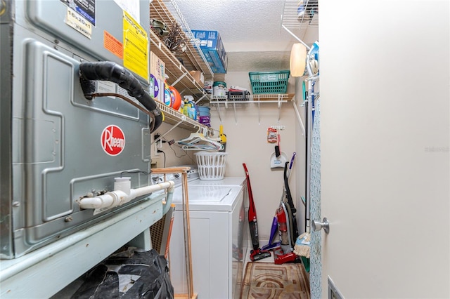 laundry room featuring a textured ceiling, laundry area, washing machine and dryer, and visible vents