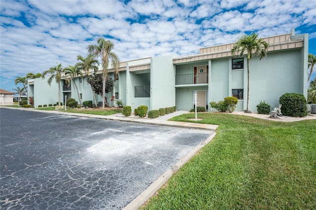 view of property with uncovered parking