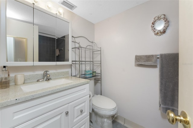 bathroom with visible vents, a shower, toilet, a textured ceiling, and vanity