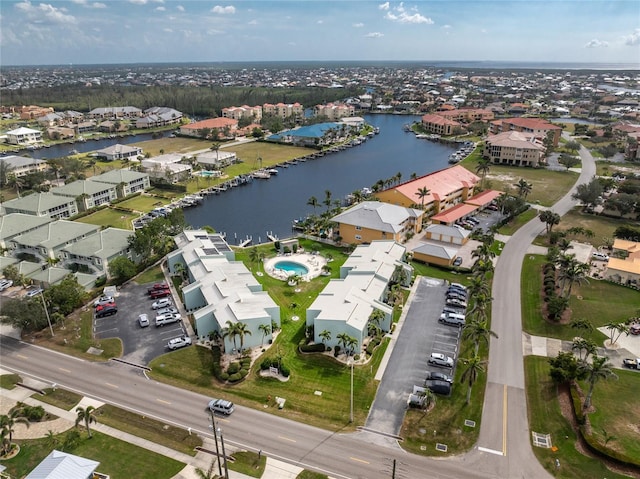 birds eye view of property featuring a water view and a residential view