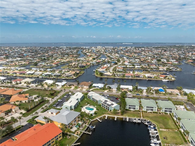 aerial view with a water view and a residential view