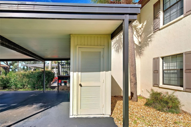 doorway to property featuring stucco siding