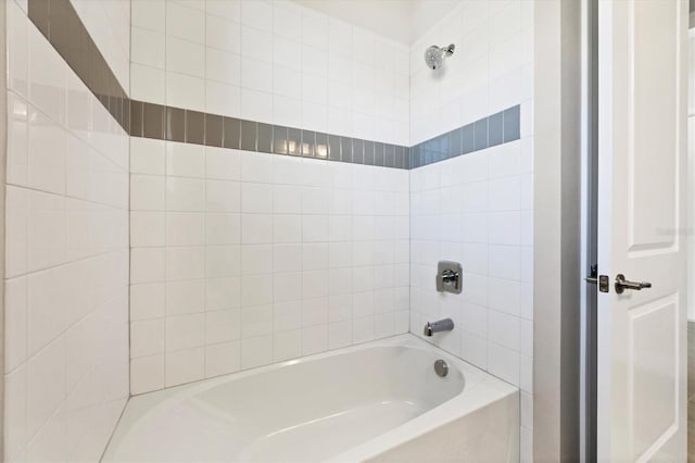 bathroom with shower / bath combination