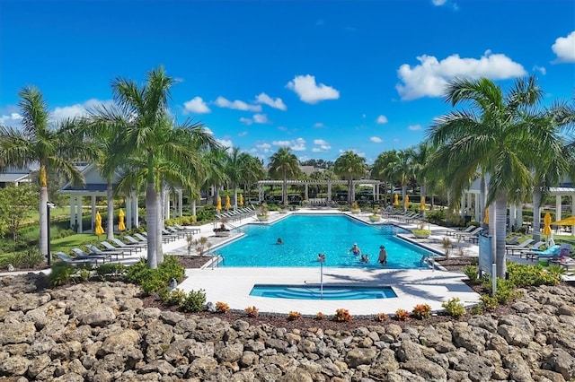 pool featuring a patio area and a pergola