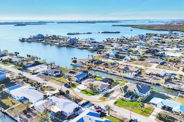 birds eye view of property featuring a water view and a residential view