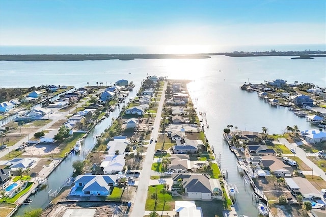 drone / aerial view featuring a water view and a residential view