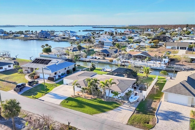 bird's eye view featuring a water view and a residential view