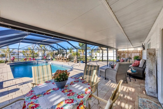 pool with glass enclosure, a patio, fence, and an outdoor living space