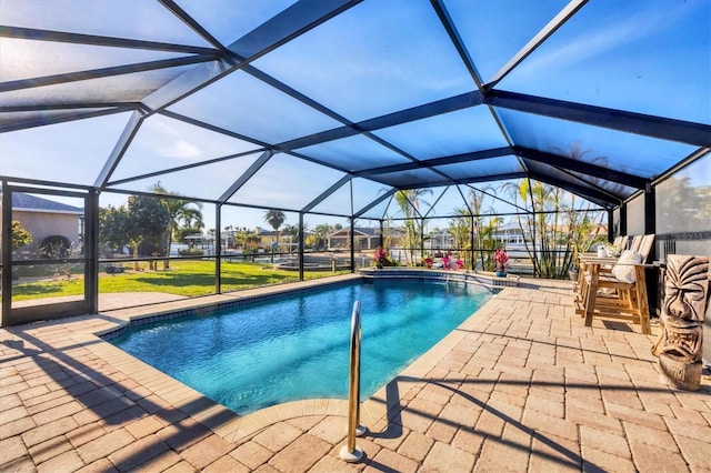 outdoor pool with a lanai and a patio