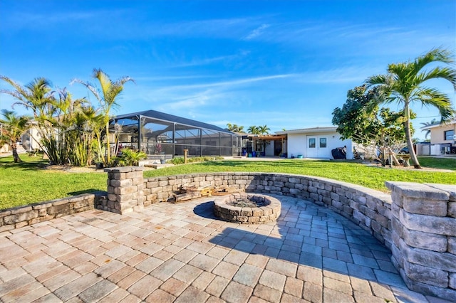 view of patio with a lanai and an outdoor fire pit