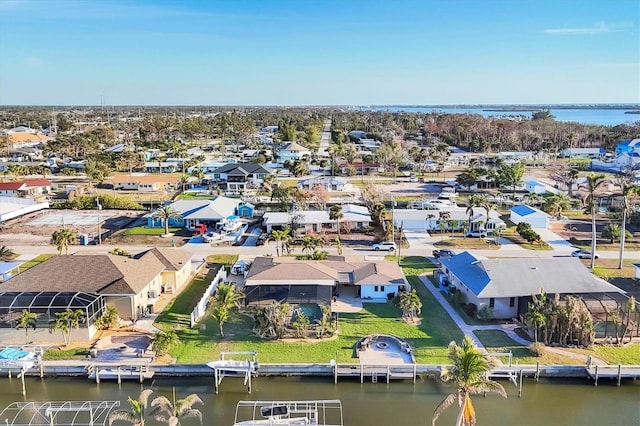 aerial view featuring a water view and a residential view