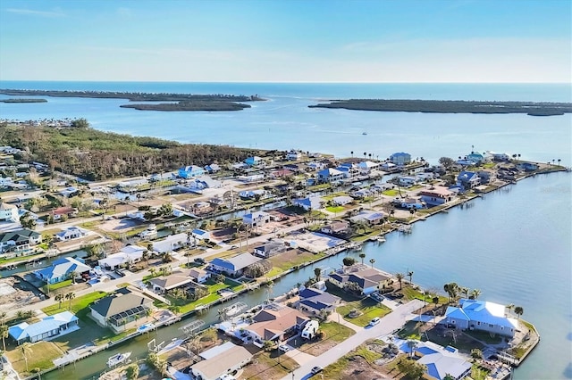 birds eye view of property featuring a water view and a residential view