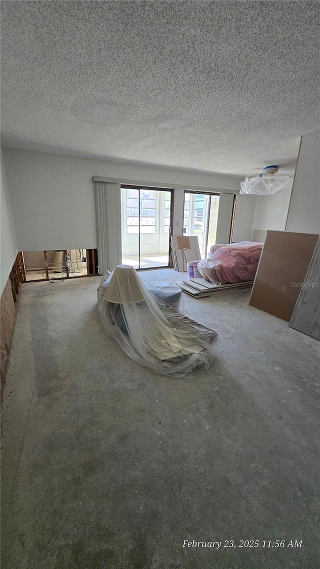 unfurnished bedroom featuring a textured ceiling and carpet flooring