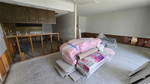 bedroom featuring concrete floors