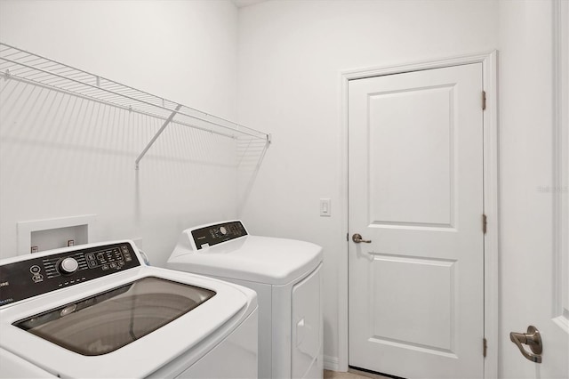 washroom featuring laundry area and washer and clothes dryer