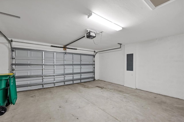 garage featuring a garage door opener and electric panel