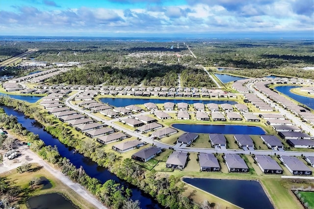 bird's eye view featuring a water view and a residential view