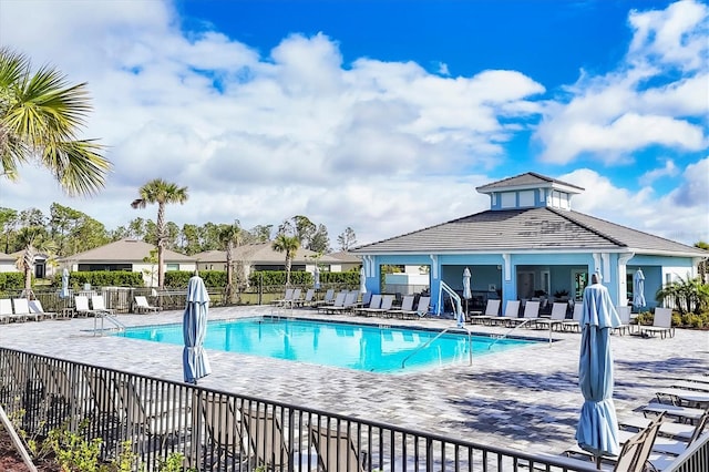 pool featuring a patio and fence