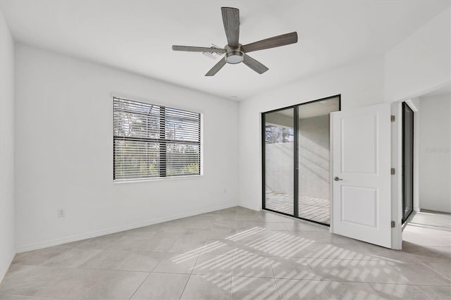 unfurnished bedroom with light tile patterned floors, ceiling fan, access to exterior, and baseboards