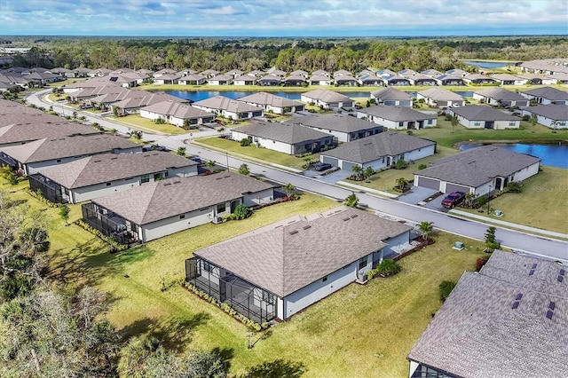 aerial view featuring a residential view and a water view