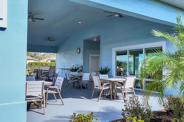 view of patio / terrace featuring outdoor dining area, fence, and a ceiling fan