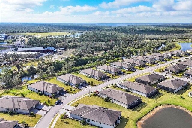 birds eye view of property with a water view and a residential view