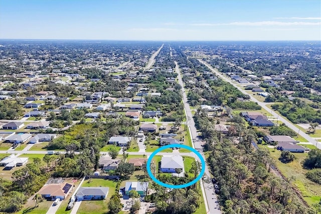 birds eye view of property with a residential view