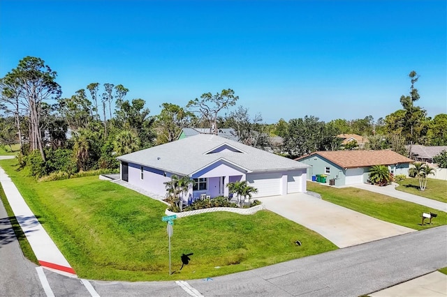 ranch-style home with driveway, a garage, and a front lawn