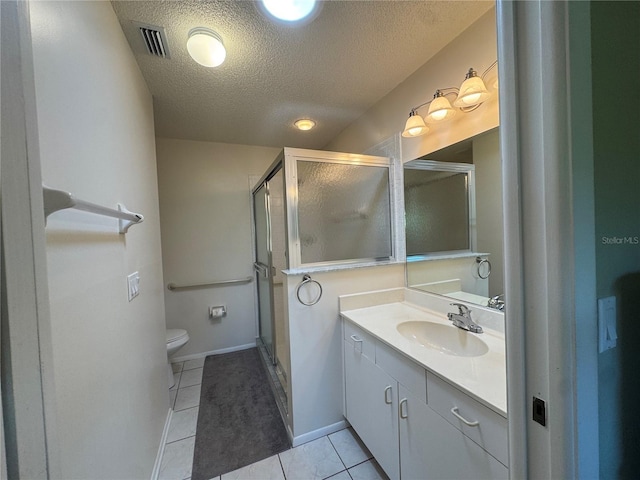 bathroom featuring visible vents, toilet, tile patterned floors, a textured ceiling, and vanity