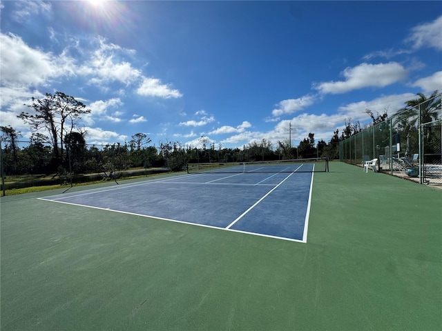 view of sport court with fence