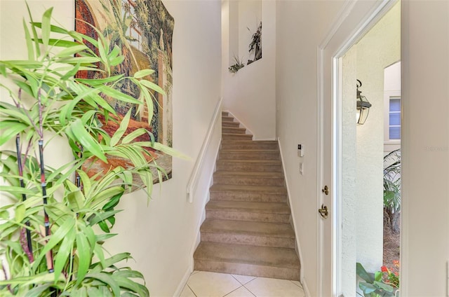 stairway featuring tile patterned floors