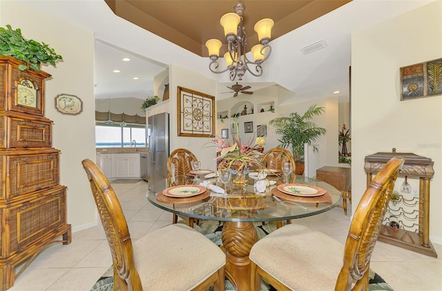 dining room with light tile patterned floors, recessed lighting, visible vents, a tray ceiling, and an inviting chandelier