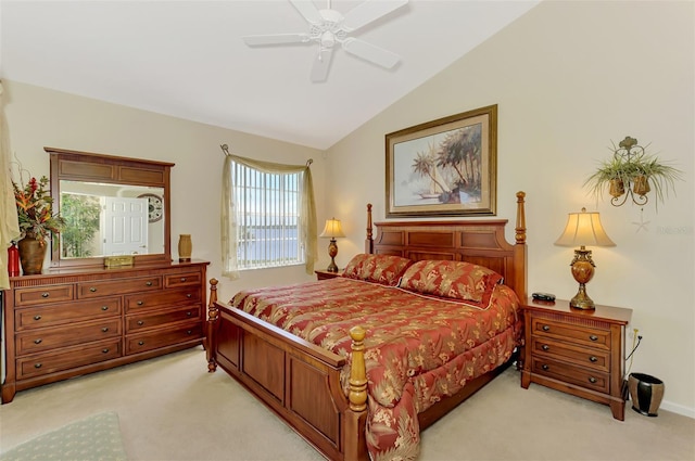 bedroom featuring lofted ceiling, ceiling fan, and light colored carpet