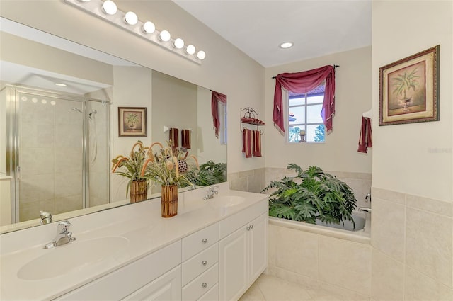 full bathroom with tile patterned flooring, a sink, a shower stall, and double vanity