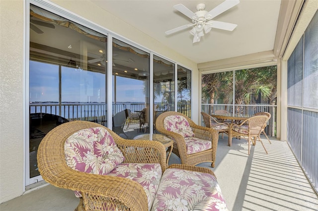 sunroom featuring ceiling fan