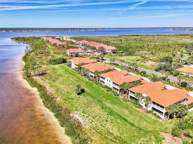 drone / aerial view featuring a water view and a residential view