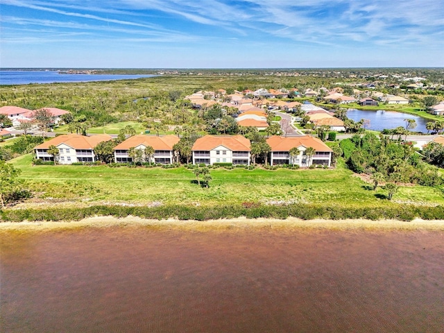 drone / aerial view featuring a water view and a residential view