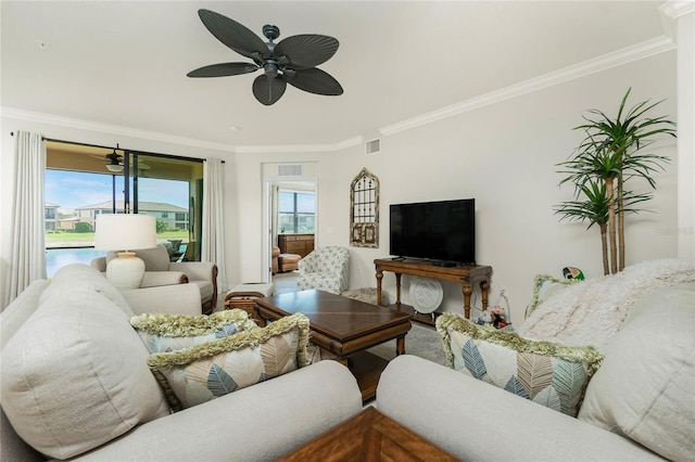 living room with ceiling fan, a water view, visible vents, and crown molding