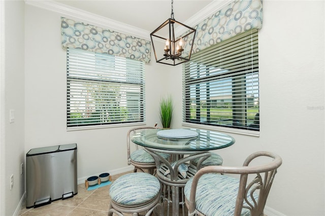 dining room featuring ornamental molding, plenty of natural light, light tile patterned flooring, and baseboards